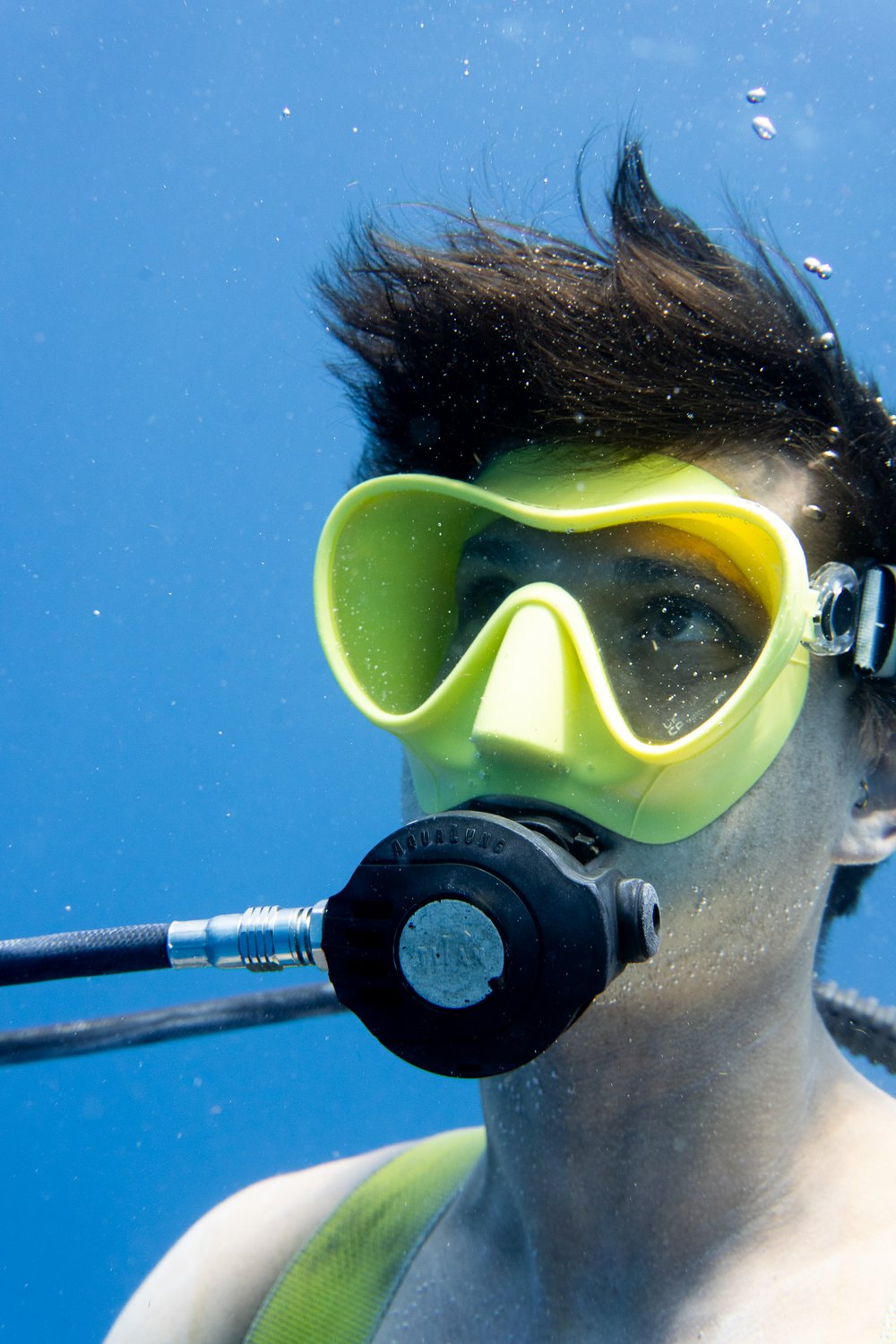 Patrick Louis diving underwater in a mask and regulator